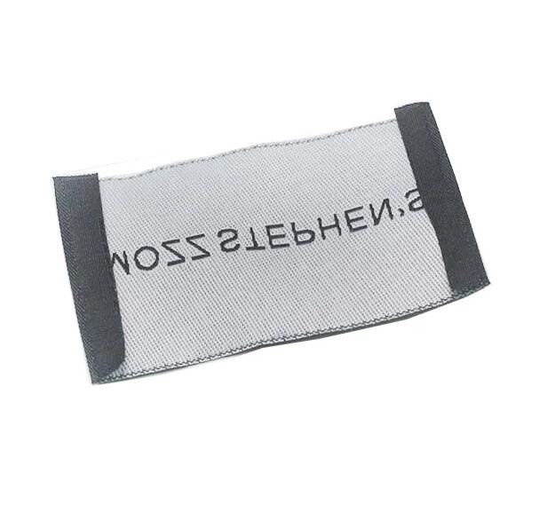 Les labels de textile tissé de mode/pli adapté aux besoins du client d'extrémité cousent sur des labels d'habillement